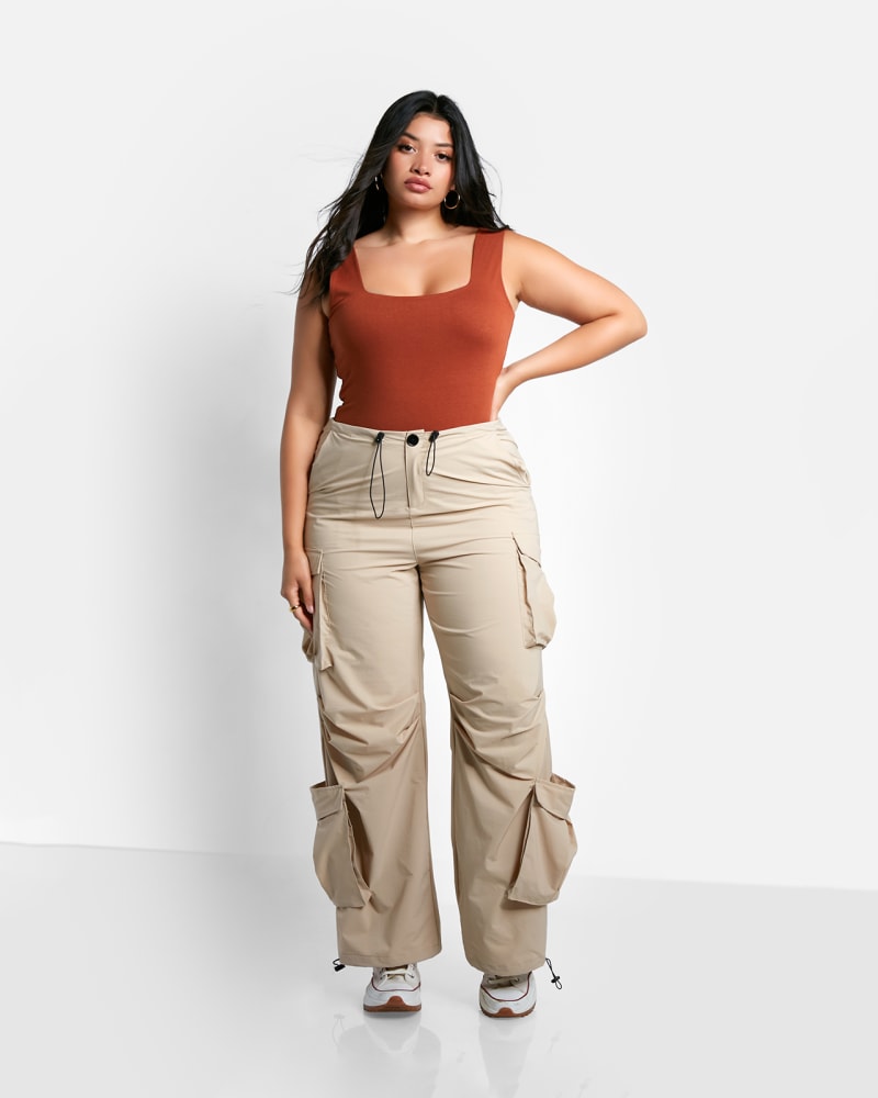 Front of a model wearing a size 4X Billie Nylon Cord Drawstring Cargo Pants in Beige by Rebdolls. | dia_product_style_image_id:324240